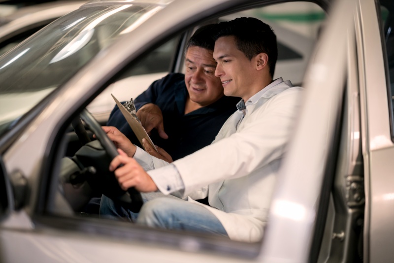 Two Men Looking at Paperwork