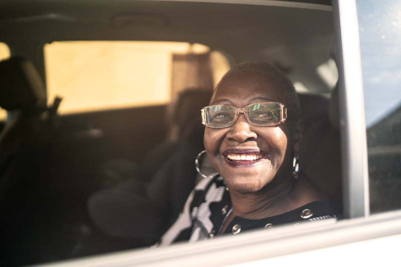 Black Woman Looking Out Car Window